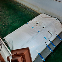 Successful experimental test of new inflatable breakwater model