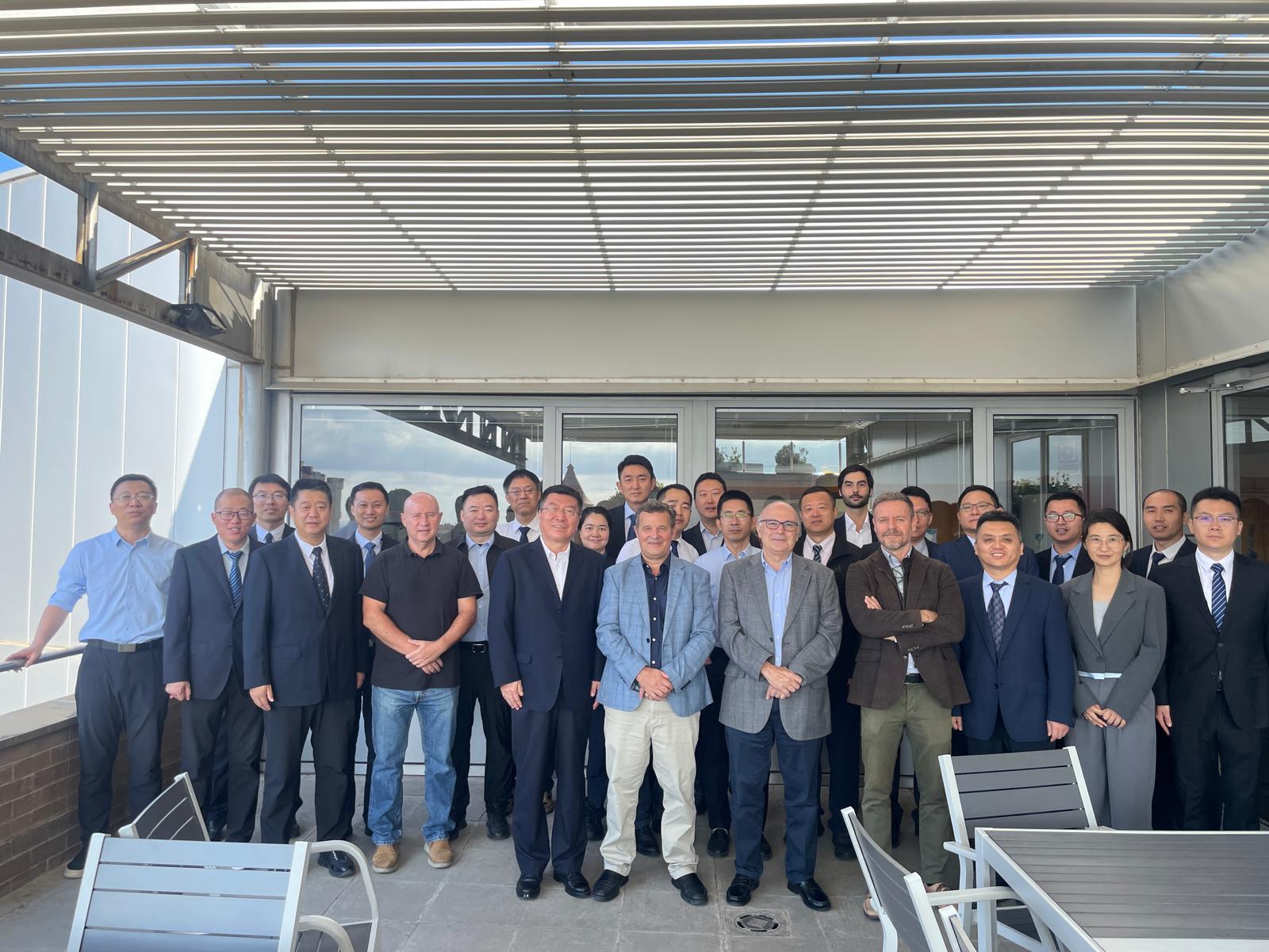 Group photo of a delegation from AVIC Shenyang Aircraft Design and Research Institute and representatives from CIMNE, taken at CIMNE’s headquarters in Barcelona on October 1, 2025. The delegation, led by Party Secretary Xi Jixing, stands alongside CIMNE’s leadership, including Prof. Javier Bonet, Jordi Jiménez, and Prof. Gabriel Bugeda, symbolizing a collaborative meeting focused on aerospace engineering and advanced simulation.