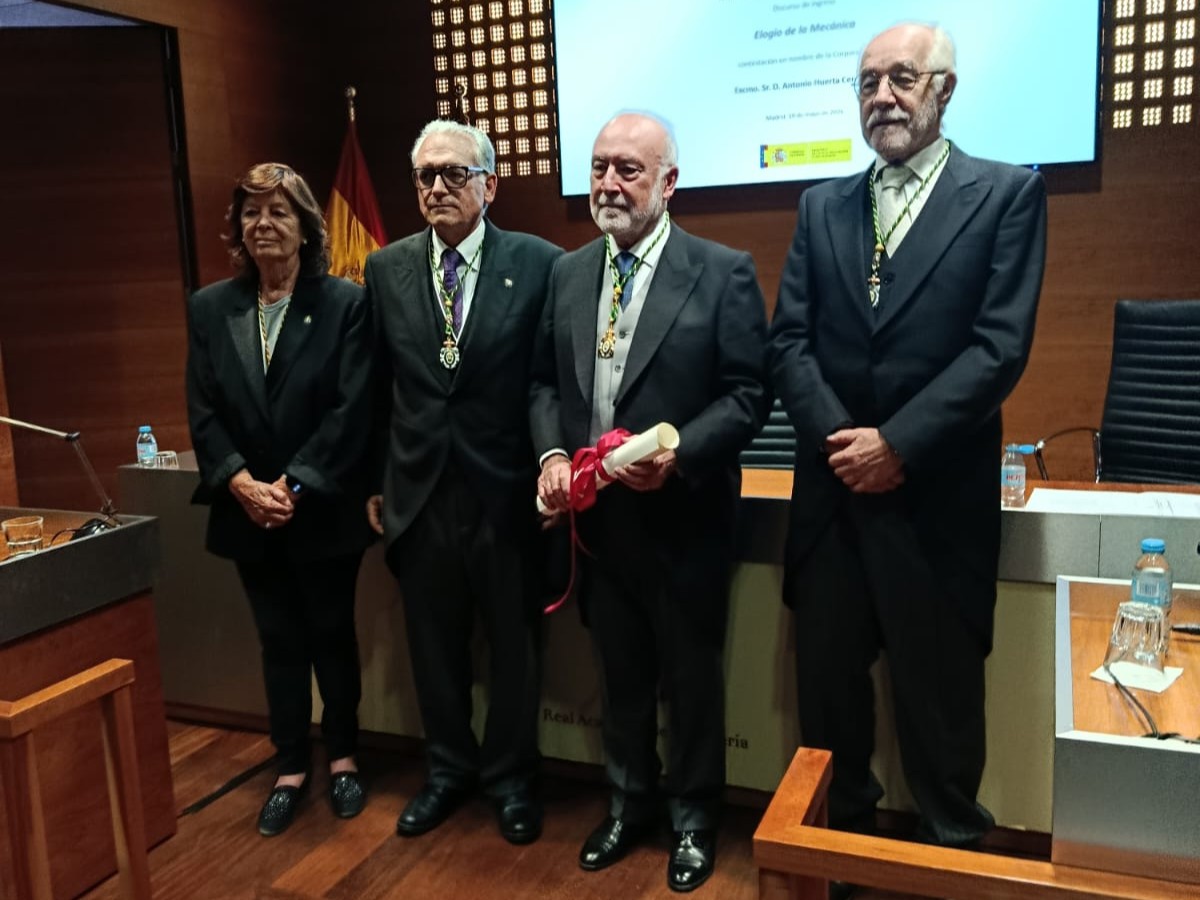 Professor Eugenio Oñate, second from right, stands with members of the Spanish Royal Academy of Engineering after his induction ceremony in Madrid, holding the formal diploma scroll.